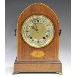 A late Victorian rosewood mantel clock with eight day movement striking on two gongs, the