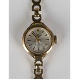 A Rotary 9ct gold lady's bracelet wristwatch, the signed silvered dial with gilt tapered baton
