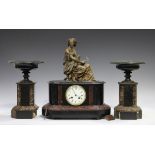 A late 19th century French slate, marble and spelter mantel clock with eight day movement striking