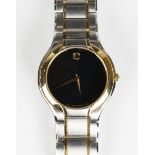 A Movado steel and gilt gentleman's bracelet wristwatch, the signed black dial with tapered gilt