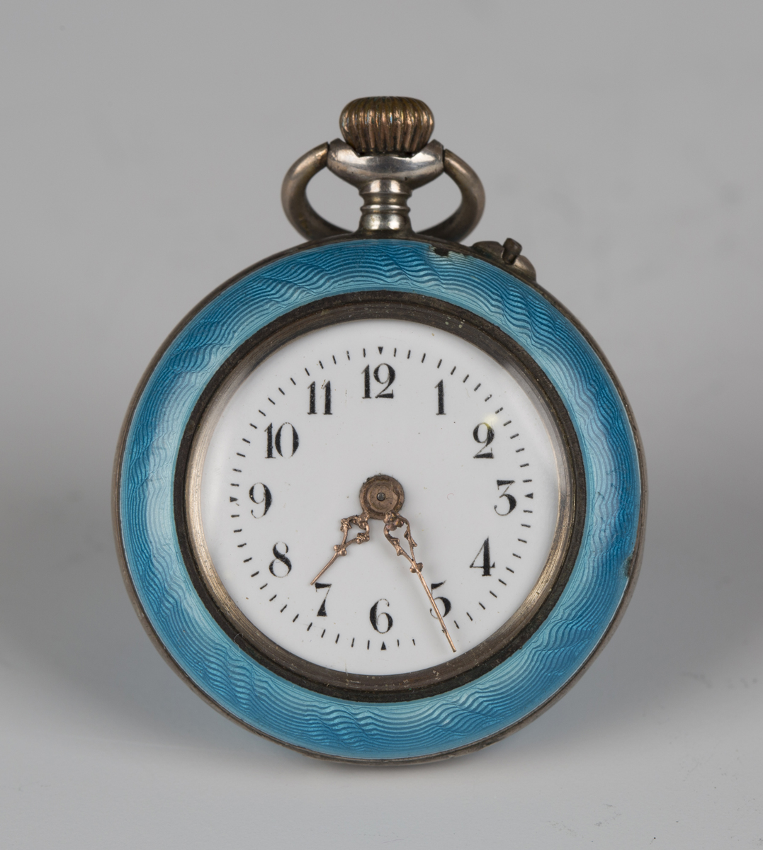 A silver gilt and enamelled keyless wind open-faced lady's fob watch with unsigned cylinder