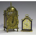 A 20th century Swiza brass and blue enamelled bedside alarm clock with eight day movement, the