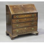 A George III mahogany bureau, the fall-flap revealing an interior fitted with cupboard, pigeon holes