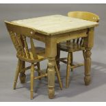 A 20th century pine two-seater kitchen table, height 77cm, width 76cm, together with a pair of