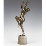 H. Calot - an early 20th century green patinated cast bronze figure of a nude female dancer, bearing