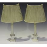 A pair of 20th century carved alabaster table lamps of column form, height 24.5cm, together with a