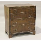 A 20th century George III style mahogany bachelor's chest, fitted with a brushing slide and four