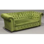 A Victorian Chesterfield settee, upholstered in buttoned green velour, on turned walnut feet, height