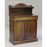 A William IV mahogany chiffonier, the carved gallery back above a concealed drawer, the cupboard