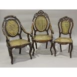 A near pair of late 19th/early 20th century hardwood framed bergère elbow chairs with double-caned