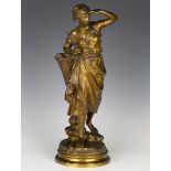 Eugène Laurent - a late 19th century French gilt patinated cast bronze figure of a fisherwoman