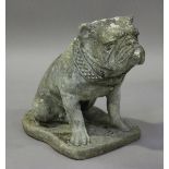 A late 20th century cast composition stone garden model of a seated bulldog, height 44cm.Buyer’s