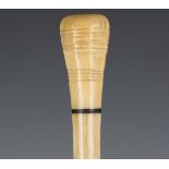 A late 19th century whale bone and marine ivory child's walking stick, the octagonal section