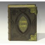 A Victorian brown leather bound family bible with gilt brass mounts and colour printed plates,