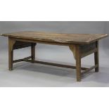 An 18th century provincial fruitwood and ash farmhouse table, the two-plank top raised on block