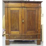 A large 19th century Continental mahogany armoire, the two panelled doors above a single drawer,