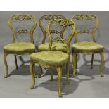 A set of four mid-Victorian bird's eye maple carved spoon back bedroom chairs, on cabriole legs,