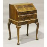 A 20th century Queen Anne style walnut lady's bureau with feather and crossbanded decoration, height