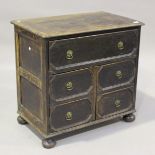 A 20th century William and Mary style oak chest, fitted with a drawer above two doors, on bun