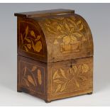 A 19th century Dutch floral marquetry decanter case, profusely inlaid with flowers and foliage,
