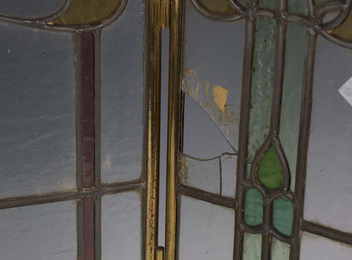 An early 20th century Arts and Crafts brass framed leaded and stained glass triptych firescreen, - Image 5 of 6