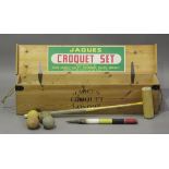 A mid-20th century croquet set by Jaques, London, within original pine box, length 110cm.Buyer’s