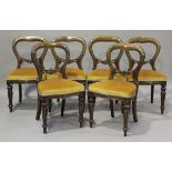 A set of six late 20th century Victorian style stained hardwood balloon back dining chairs, on