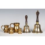 A set of four Victorian brass graduated tankard measures, all inscribed 'E. Sutton', together with