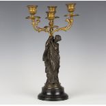 Mathurin Moreau - a late 19th century French brown patinated and gilt cast bronze three light