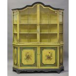 An early/mid-20th century Dutch display cabinet, painted with swags and floral sprays, the shaped