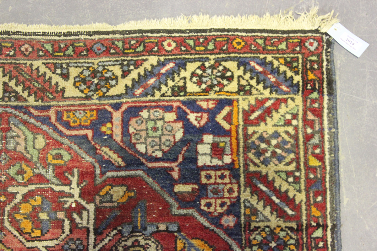 A Hamadan rug, North-west Persia, mid-20th century, the red field with a flowerhead medallion, 175cm - Image 4 of 7