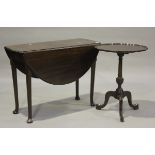 A George III mahogany circular drop-flap breakfast table, on turned legs and pad feet, height