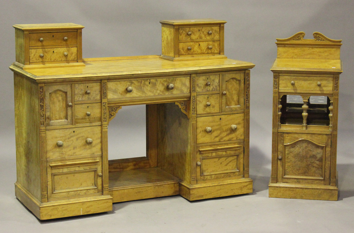 A late Victorian satinwood bedroom suite by M. Woodburn of Liverpool, comprising a wardrobe,