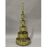 A 20th century gilded cast metal temple surmount, probably Indian, height 111cm, diameter 39cm.