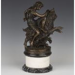 A modern brown patinated cast bronze figure group of a Classical maiden upon a rearing goat,