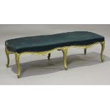 A 19th century French gilt painted window seat, the overstuffed seat raised on carved cabriole legs,