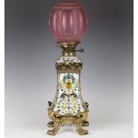 A late 19th century French opaline glass and gilded bronze table oil lamp, the glass lift-out