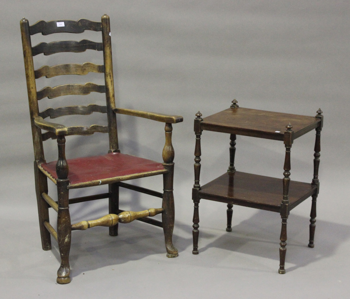 A 19th century ash ladder back carver chair, on turned legs united by stretchers, height 110cm,