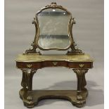A late Victorian mahogany Duchess dressing table by Taylor, Fisher & Blunt, London, raised on carved
