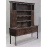 An 18th century and later oak dresser with mahogany crossbanded borders, the later shelf back