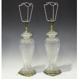 A pair of modern moulded glass and cast brass table lamps, height 16cm.Buyer’s Premium 29.4% (