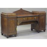 A William IV mahogany twin-pedestal sideboard with applied beaded and moulded decoration, fitted