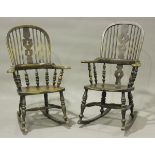 A near pair of Victorian ash and elm pierced splat back Windsor rocking armchairs with shaped hand