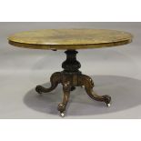 A late Victorian burr walnut oval tip-top breakfast table, raised on carved cabriole legs, height