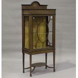 An Edwardian mahogany display cabinet with overall inlaid decoration, in the manner of Edwards &