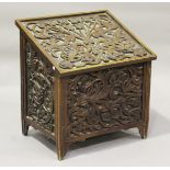 An early 20th century mahogany slope-front log box with carved foliate decoration, height 72cm,