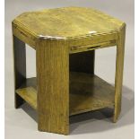 An early 20th century oak canted square book table by Fyne Ladye Furniture, fitted with four slides,