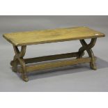 A 20th century French oak coffee table, on 'X' framed supports, height 48cm, length 120cm, depth