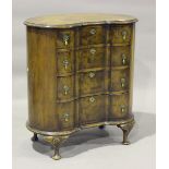 An early 20th century Queen Anne style walnut kidney shaped chest, raised on cabriole legs, height