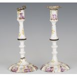 A pair of mid-18th century South Staffordshire enamel candlesticks, decorated with manganese